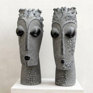 Black marble Egyptian male female face sculpture