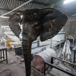 Metal elephant face sculpture
